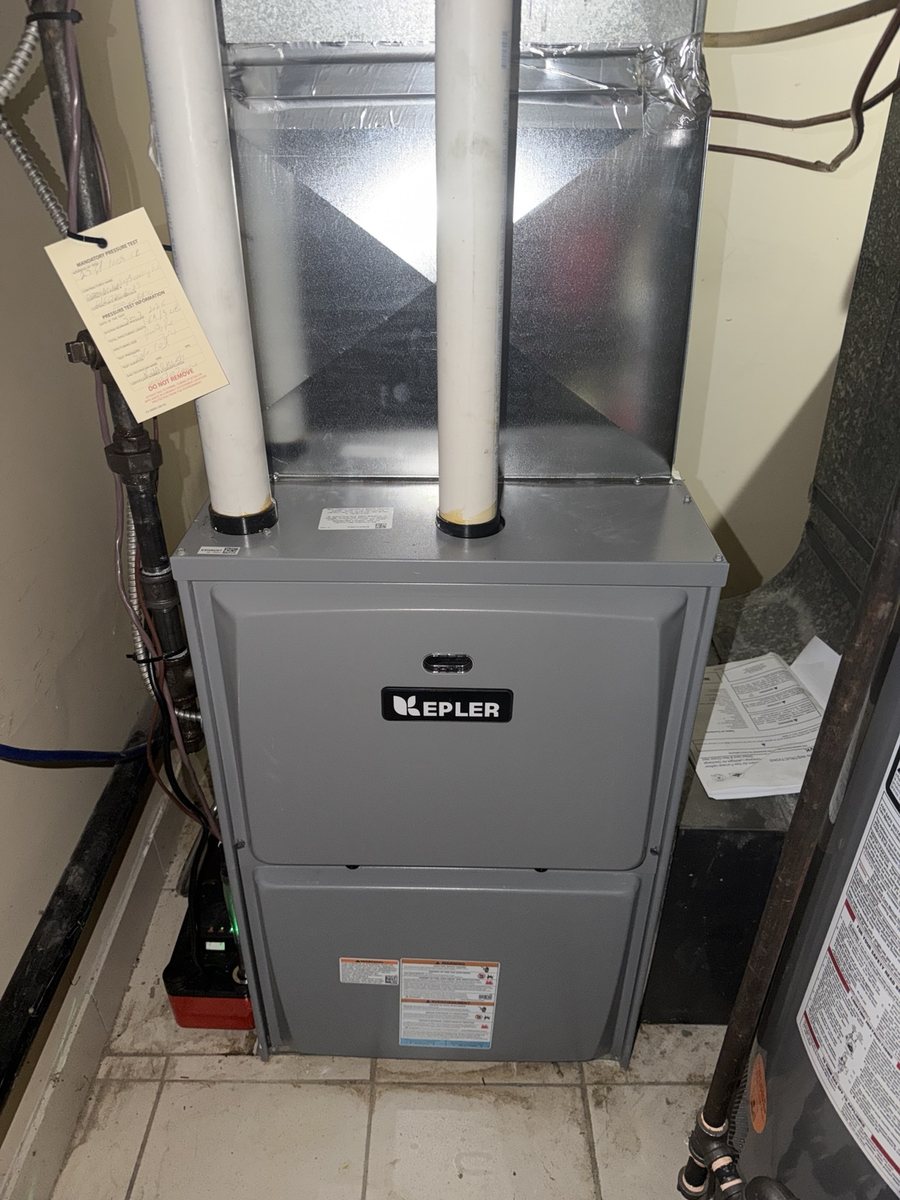 Kepler furnace installation with ductwork and white vent pipes